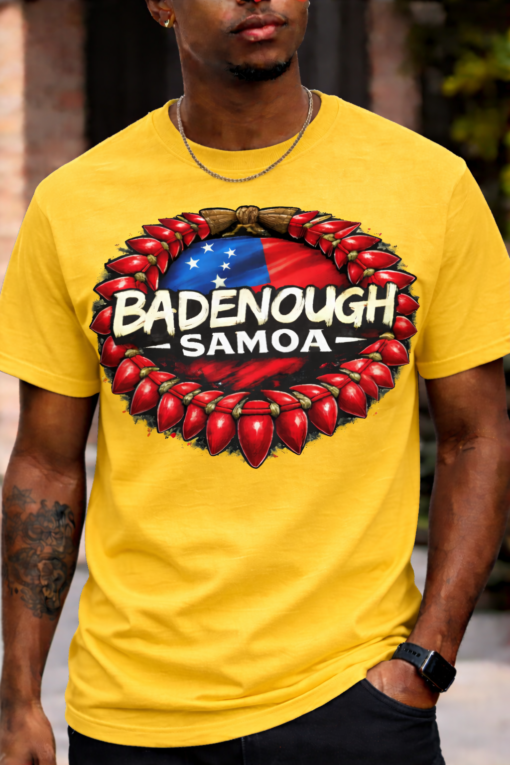 Person wearing a yellow t-shirt with 'Badenough Samoa' graphic design.